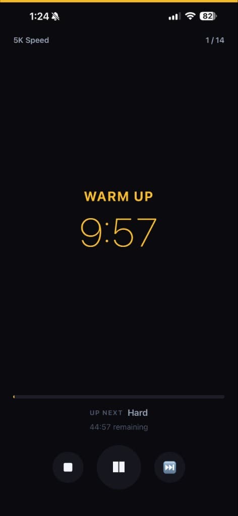 SplitCue active workout timer showing warm up countdown at 9:57